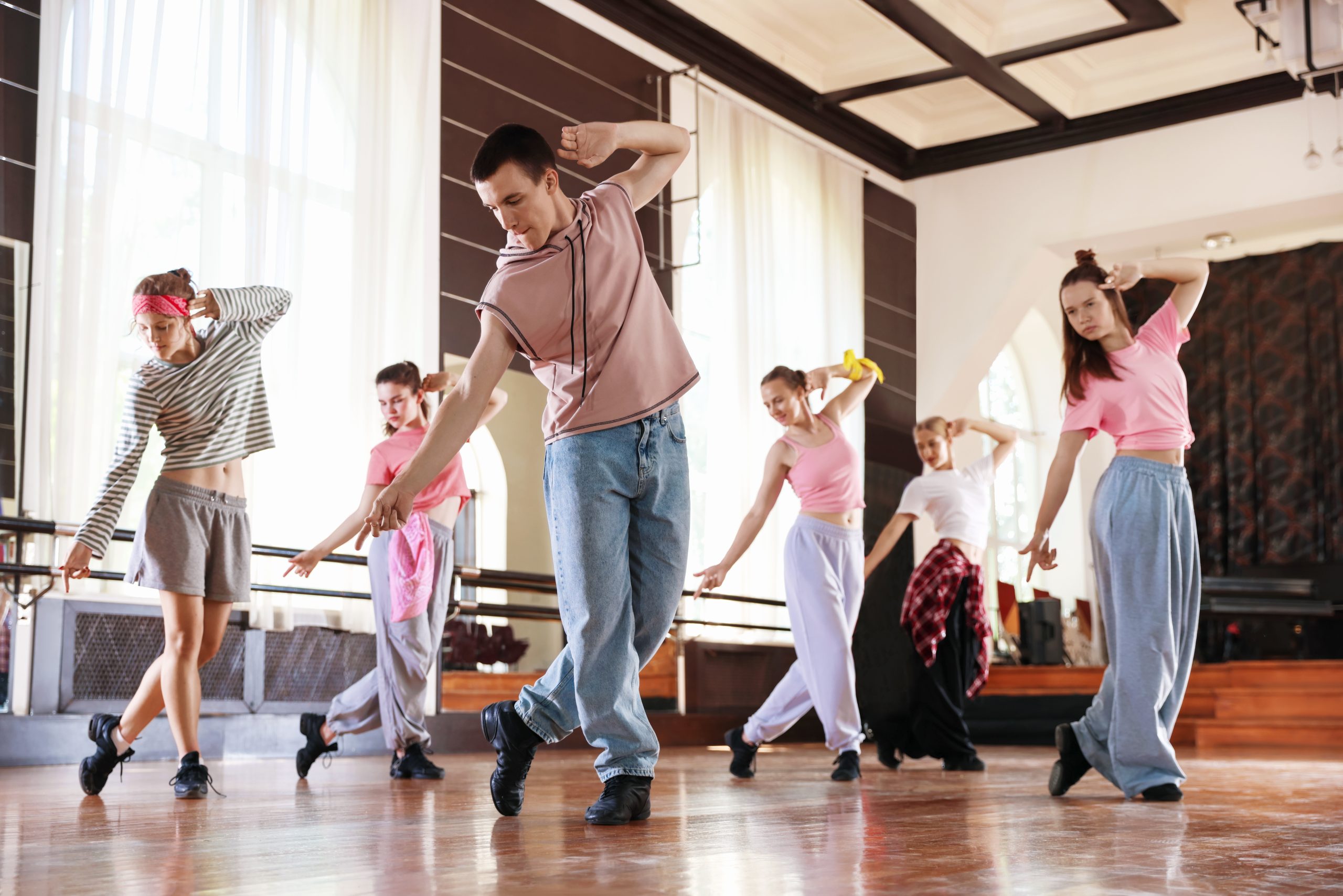 Energetic group exercising together in a studio